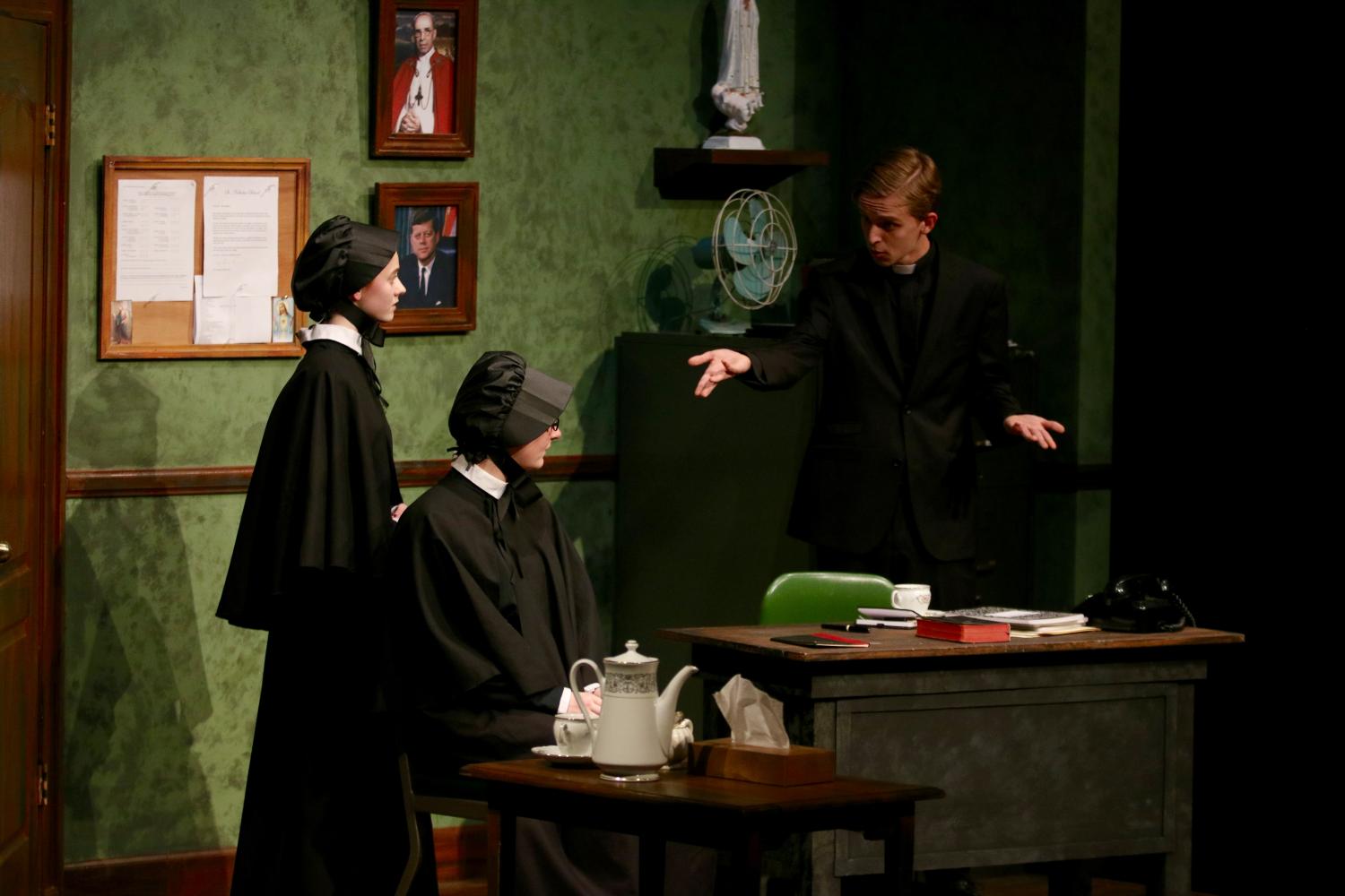 Nick Kime 17, Ella Schmidt, 17, and Kaitlyn Wallace 17 on stage during the production of Doubt. 