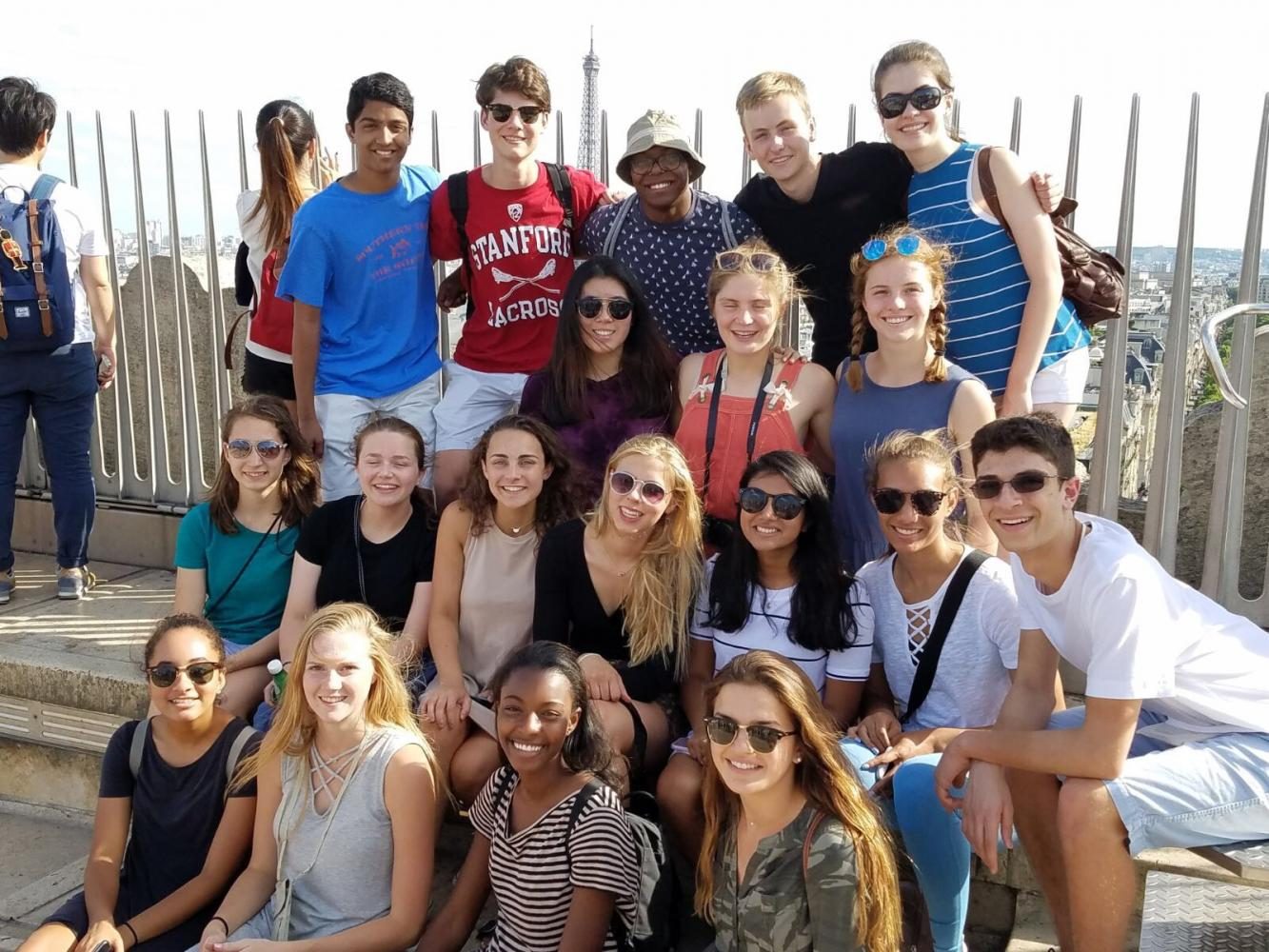 19 JBS students pose for a picture at the top of the Arc de Triomph.