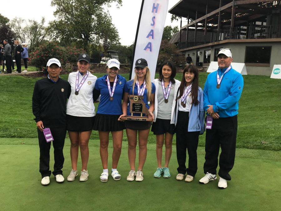 Lucy Bloomstran, 19’, holds the 3rd place trophy as the Women’s Varsity Golf teams smiles for a picture after an exciting state tournament.
                              
